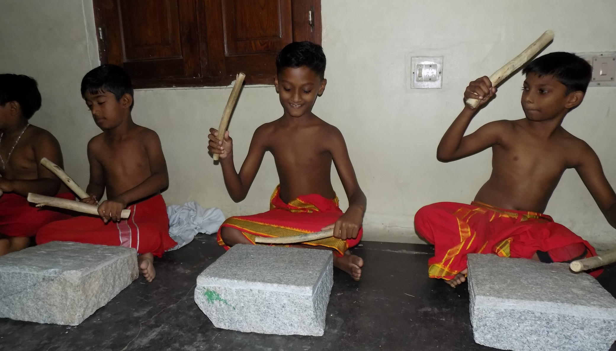 Musical instruments for 17 slum children in India